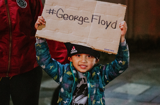 Boy protesting for George Floyd