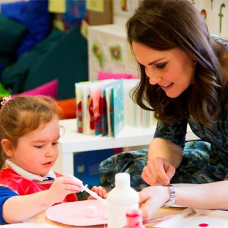 The Duchess of Cambridge helping a child do crafts