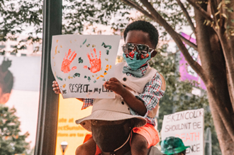 child taking part in protest