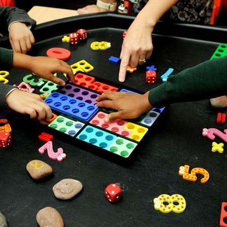 children playing with toys on therapy table