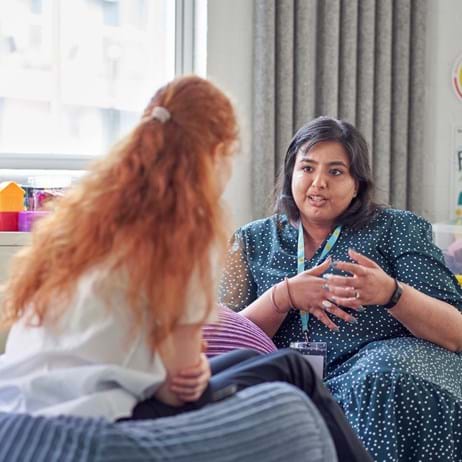 counsellor talking to school pupil in Place2Be therapy room