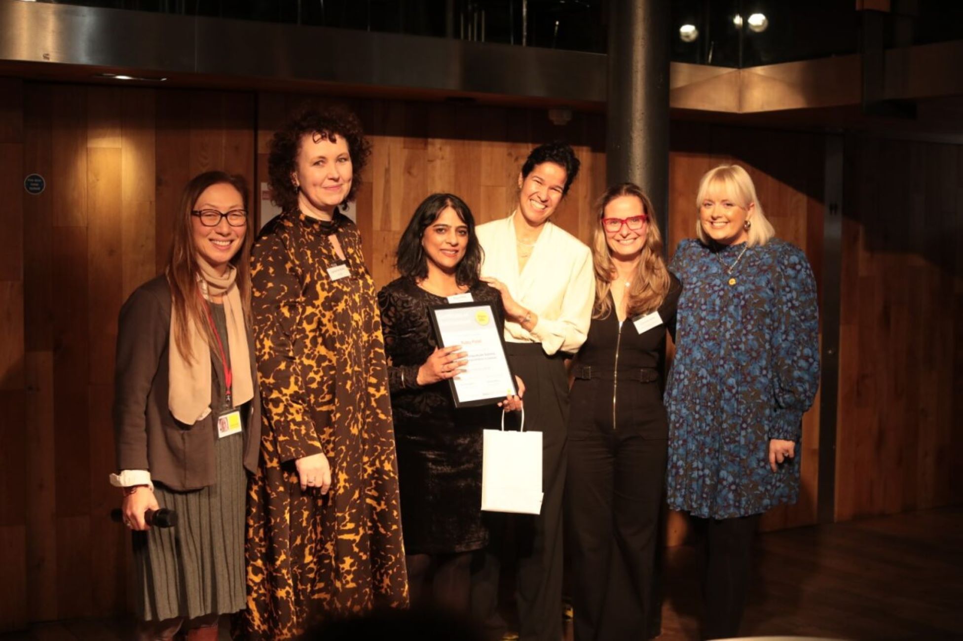 Place2Be staff including Chief Executive Catherine Roche, alongside Place2Be Ambassador Katie Thistleton and a 2023 graduate at the ceremony.