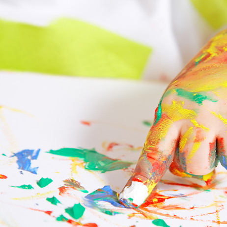 Child painting with their hands