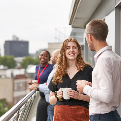 Employees chatting on roof