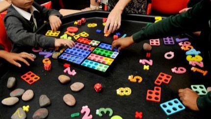 Students playing with toys