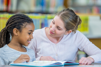 Child and adulting reading together
