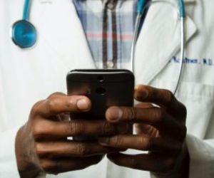 Close-up of a doctor using his phone