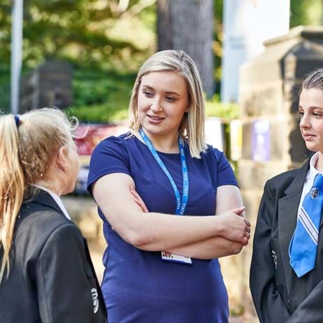 Teacher talking to pupils