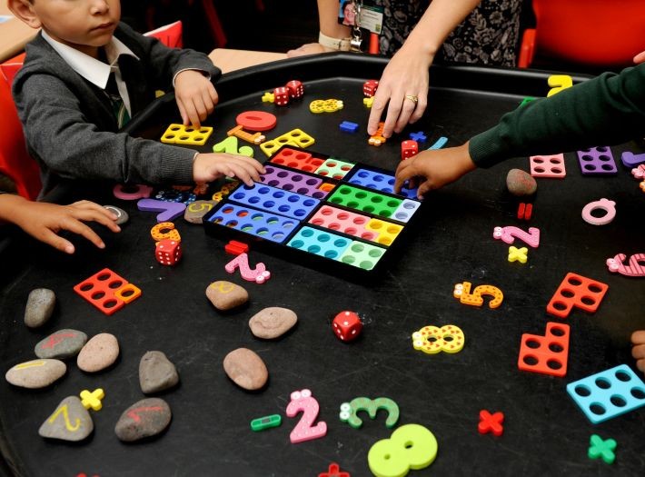 Students playing with toys