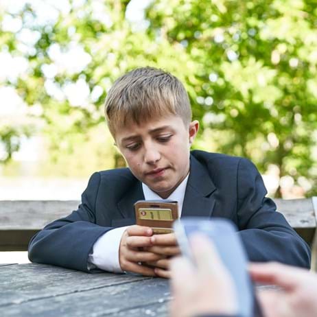 Boy looking at mobile phone