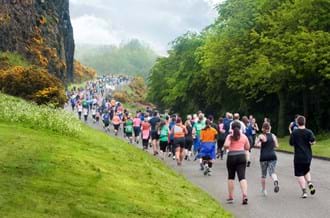 Group of marathon runners on hill