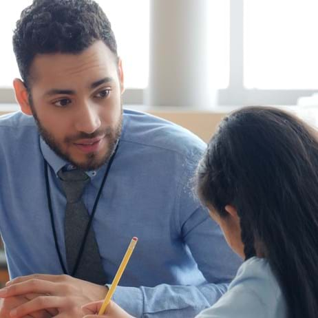 Teacher tutoring child