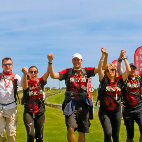 Group of people with arms in air