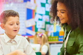 Teacher and pupil in classroom