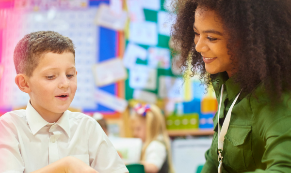 Teacher and pupil in classroom