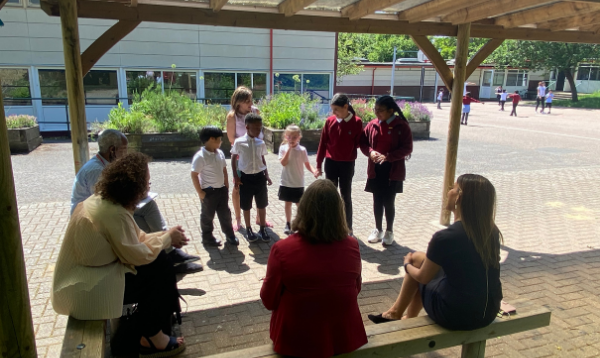 Pupils at Heathmere talking to the MPs in the playground