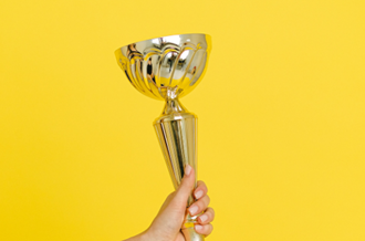 Hand holding award