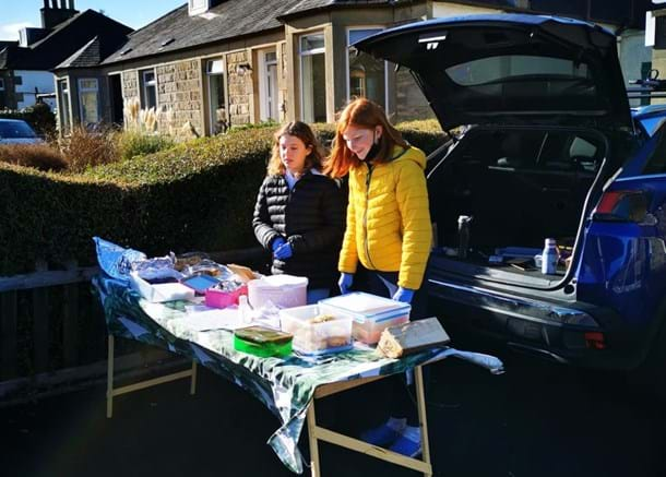 Two girls doing a bake sale