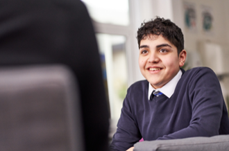 Secondary aged male student, smiling