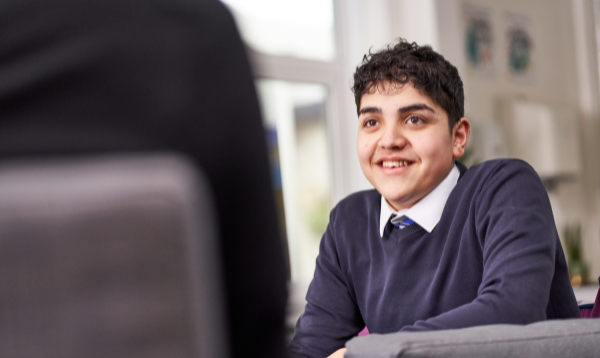 Secondary aged male student, smiling