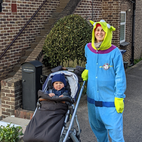 Rosie dressed as alien with her son in a pushchair