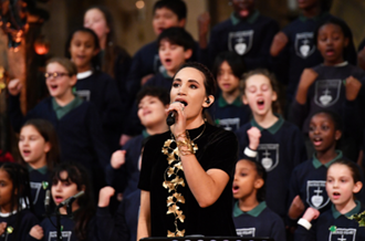 Laura Wright performs with the choir from Sacred Heart Catholic Primary School