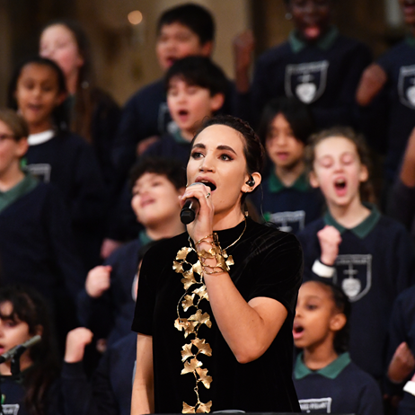 Soprano Laura Wright singing with school choir