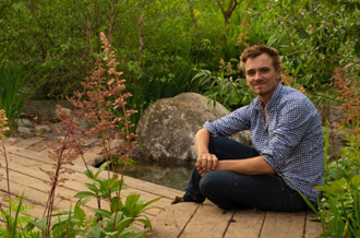 Photo of Jamie Butterworth in a garden