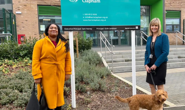 Streatham MP, Bell Ribeiro-Addy MP with Principal Gizle Landman and dog Mabel outside the school gate
