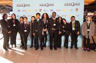 Amazing Arabella at the Here4You premiere standing with school pupils
