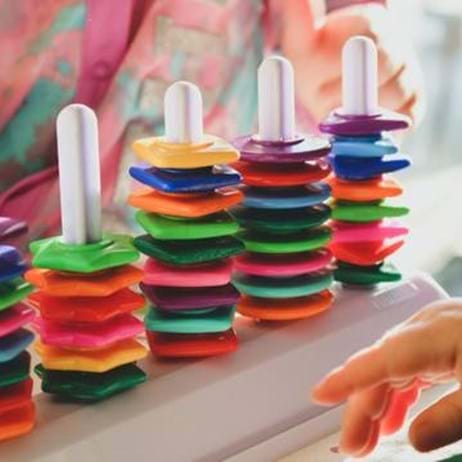 children playing with colourful donut blocks