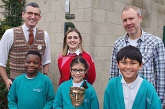 BAFTA Roadshow hosts Ben Shires (left) and Kia Pegg (centre), and guest speaker from Moonbug Entertainment Dan Balaam standing with Churchfield Primary School students.