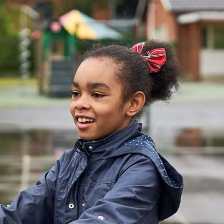 Girl smiling in a playground