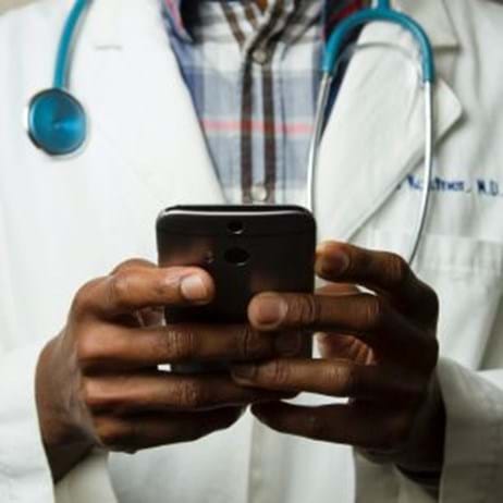 doctor holding smartphone