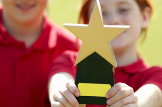 Children holding trophy