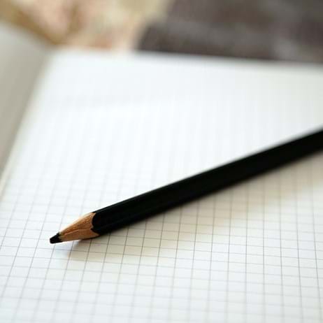 Paper and pen in classroom