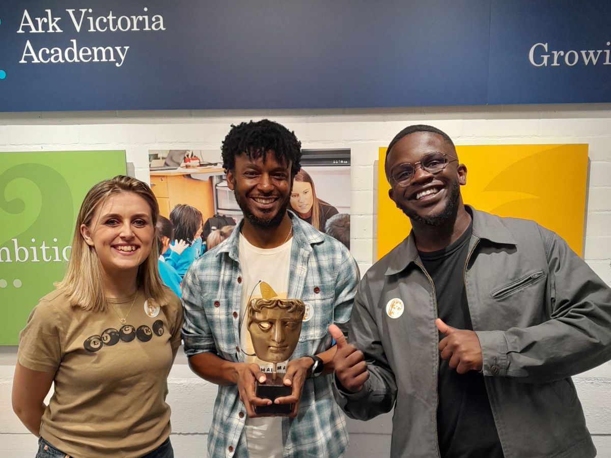 Kia, Corey and DeGraft holding a BAFTA award