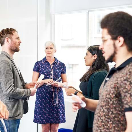 Group of counsellors standing, doing training