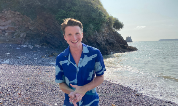 Josh smiling on the beach