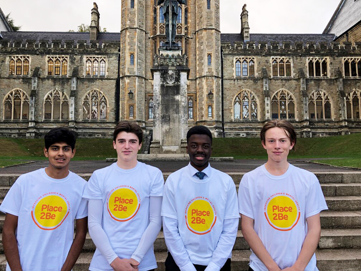 College students wearing Place2Be fundraising t-shirts