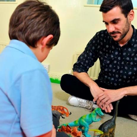Child playing with toys in counselling session