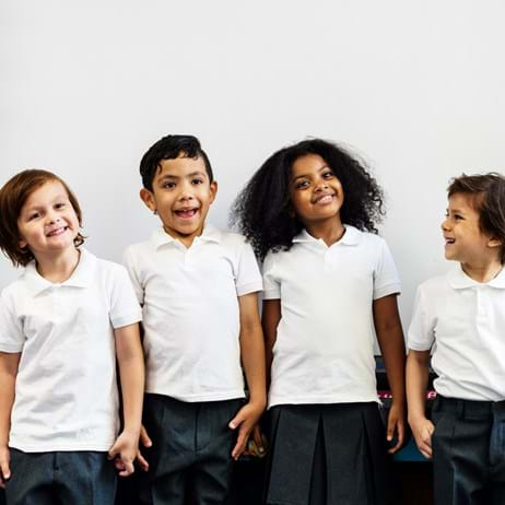 Young children in school smiling