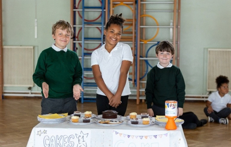 Primary school children hosting a bake sale