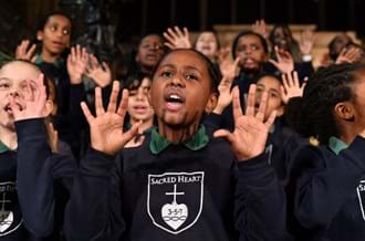 Students from Sacred Heart school choir singing at the Carol Concert