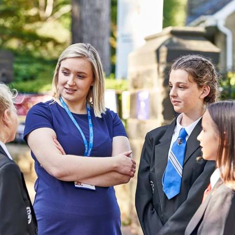 Teacher speaking to students