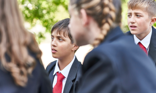 unhappy teens in playground