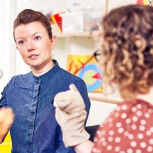 Counsellor with puppet training in child counselling