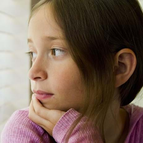 Girl looking out window