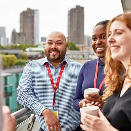 office staff talking on balcony