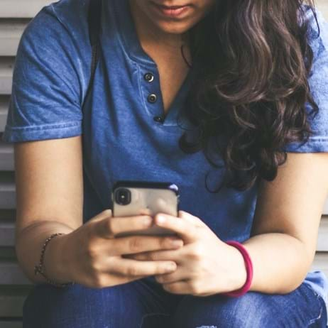 Girl looking at mobile phone